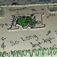 Retirementcake.jpg This was two 1/2 sheet cakes put together...one chocolate the other yellow.... buttercreme icing....and my 1st FBCT of the school logo....I...