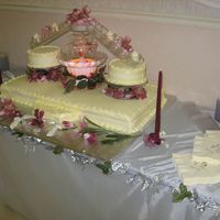 Stardust This cake was replicated from a photo. The bottom layer is 1 1/2 full sheet. The 2 tops cakes are 8" or can be dummy cakes and the...