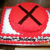 X Men Belt Buckle Cake I did this one at work as well. Someones son is a big fan of the Wolverine character on the movie. I fixed the red showing thru the black X...