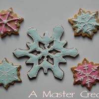 Snowflake Cookie Ornament First try with this cookie cutter. Outline took a while, but I think it came out great. It's currently hanging on the tree...too...