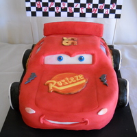 Lightning Mcqueen Hand carved, Devil's Food cake. Wheels are RKT covered in fondant. TFL