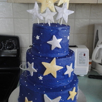 Starry Night Cake 6, 8, and 10 inch tiered cake w/royal blue icing and fondant stars. Was a little lop-sided but turned out cute for a friend's PTA...