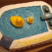 Just Ducky Baby Shower Cake made of 4 sheet cakes. I carved the bathtub shape, covered it in vanilla buttercream, blue buttercream for the 'water...