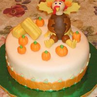 Thanksgiving Turkey Cake 9" Carrot cake w/ cream cheese icing & Toba Garrett's fondant. Made for co-worker who wanted to bring a 'centerpiece&#...