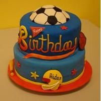 Aidans Sports Cake Cake for my friends little boy. 10" and 8" cake. All decorations are gumpaste and fondant. Happy birthday was gumpaste and...