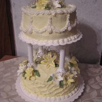 Weddingcake2.jpg This was my final course cake for Wilton III. The lilies are all royal icing and the baby's breath was 'fresh' from my rose...