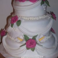 My 1St Wedding Cake Bottom 12" layer 1/2 Chocolate 1/2 Vanilla 2nd layer 9" all Chocolate 3rd layer 6" all Vanilla.All flowers & swags were...