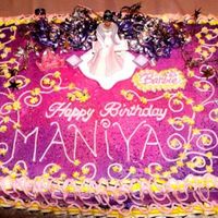 Barbie Birthday Cake Purple and hot pink sheet cake adorned with fantasy-like decorations
