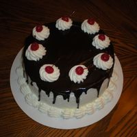 Cherry Chocolate Cake Chocolate cake w/cherry filling, and stabalized whip cream frosting. Chocolate topping is just melted chocolate and light cream.