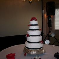Pearls And Roses 14", 12", 10", 8" and 6" alternating with chocolate cake and raspberry filling and vanilla butter cake and...