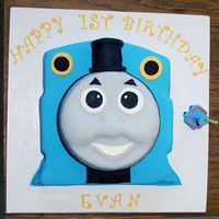 Thomas The Tank Engine Sheet cake for back of engine and then 3 x round cakes for face.