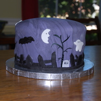 Spooky Graveyard Yellow cake covered with swirly purple/black fondant. Idea taken from this site.