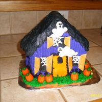 Haunted House My first stand up cake. All BC frosting with sticks of gum smeared with BC frosting for the shutters. Pumpkins are candy.