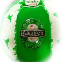 "heineken" Cake Its my first time doing a cake like this, the bottle is covered with fondant, the rest of the cake with buttercream...10" inch round...