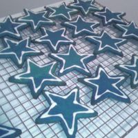 Dallas Cowboys Logo Sugar cookies dyed blue with white RI outline. Dallas Cowboys logo cookies for my boyfriends trip to Dallas this weekend to see his team...