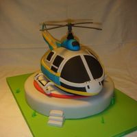 Helicopter Hard to give the correct shape to cake. Everything is edible apart from the propeler (plastic, taken from a toy)