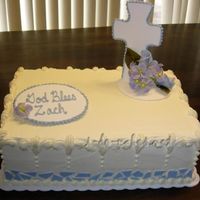 First Communion Cake Buttercream with pastillage cross and plaque. Gumpaste hydrangeas and rosebuds. Chocolate mosaic on sides.