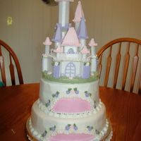 Castle Cake This cake was for twin girls 1st Birthday. I bought a cake topper of the castle in styrofoam and then embellished it.