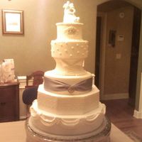 Wedding Dress Cake This cake was made to mimic some of the details of the wedding dress. It is covered in fondant with cornelli lace, antique lace, pearl,...