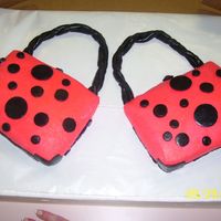 1St Cake Sold Hot Pink Purse This purse was made with the Wilton Book Pan and we seperated it into 2 cakes. The icing is buttercream with black fondant accents. This is...
