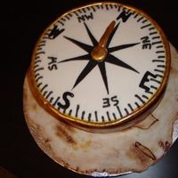 Compass i did this for a history teacher for her bday he bf asked me to... underneath is a antique map of puerto rico that i did in fondant ...she...