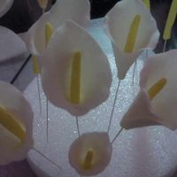 Calla Lillies they are not completely done but its my first time doing a flower.... its for a wedding cake next week! my 1st wedding im excited!!