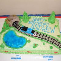 Thomas Train Cake Andrew's 3rd Train BirthdayButtercream Cake, buttercream details. Tunnel made out of a muffin coated with buttercream, trees an ice...