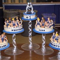 Wrestling Cake molding chocolate figures, trophy is molding chocolate with a silver glaze. it was a big hit at my son's wrestling banquet last night...