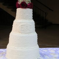 Fondant Wedding Cake With Real Flower Arrangement My first wedding cake ever, and the bride (my friend) wanted rolled fondant.It was far from perfect but everybody liked the peach flavor...