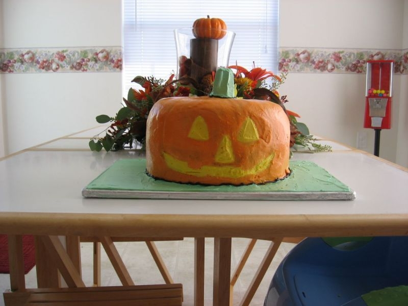 My First Attempt At A Pumpkin Cake this cake was a combo 17yr old bday cake and halloween cake, It is two fluted yellow cakes turned upside on one another. I then baked a...
