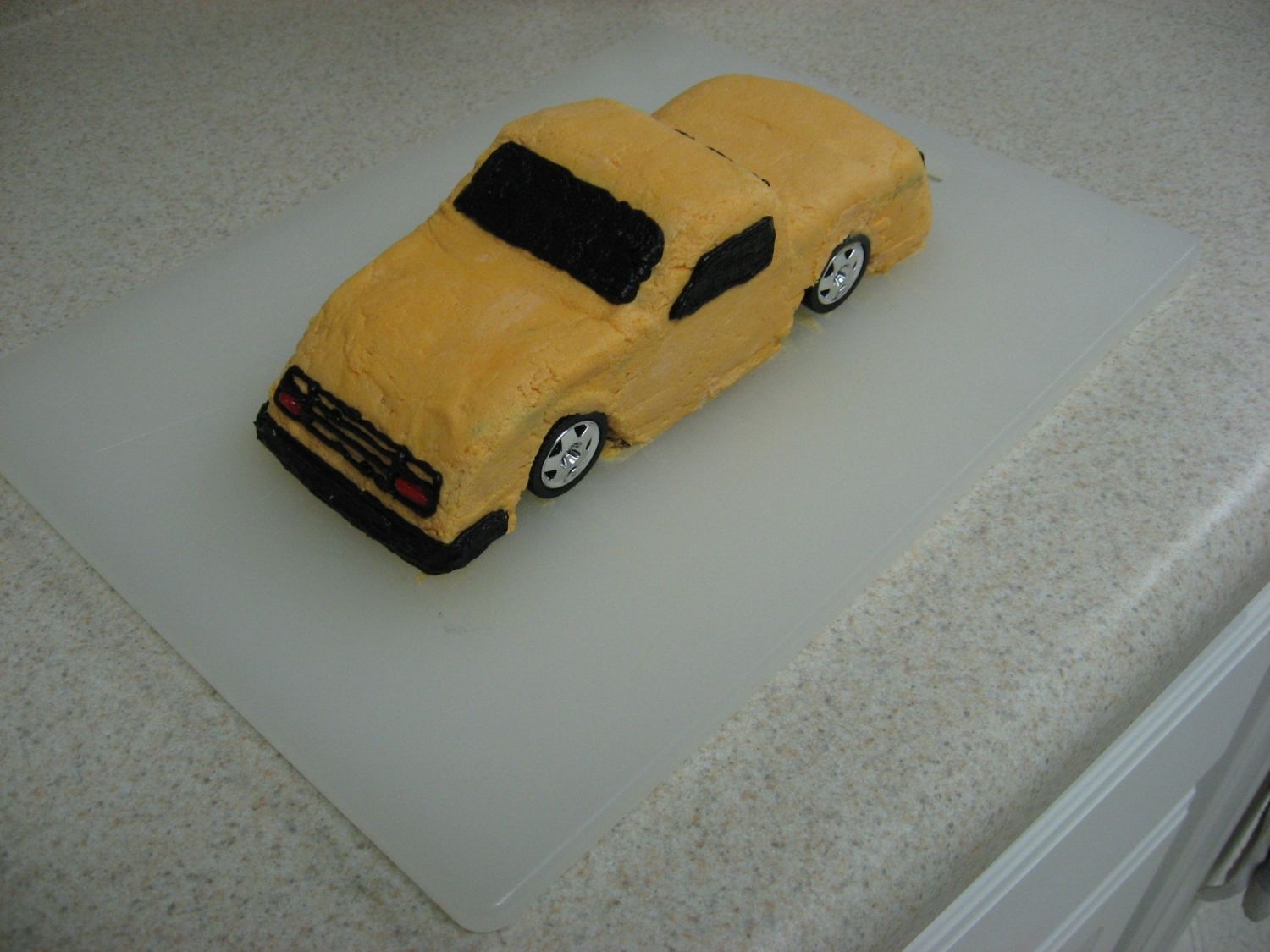 Lowrider Truck So my second cake...and first carved cake was an attempt at a lowrider truck that my 5yr old son wanted. The carving was fun! I had some...