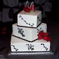 Black And White Wedding Cakes were yellow marble and french vanilla with raspberry and chocolate mousse fillings and BC frosting. Patterned from a picture the...
