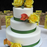Garden Wedding Bride wanted a really simple cake with fondant, fabric ribbon and fresh flowers. Cake flavors are chocolate and lemon.