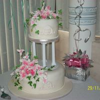 Calla Heaven These were fruit cakes covered in fondant. The flowers are gumpaste. Thought I had too much pink when I did the callas but when I put...