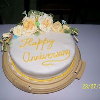 Anniversary Cake A practice cake I did to keep the fingers busy in sugar. It's a sponge cake covered in fondant, the royal was a just a bit runny