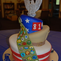 Topsy Turvy Eagle Scout Cake 3-tier Topsy Turvy cake Eagle Scout Cake. The topper is gumpaste and modeling chocolate, the sash is modeling chocolate and all the badges...