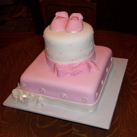 Baby Girl Baby Shower Baby shower cake with pink baby shoes.