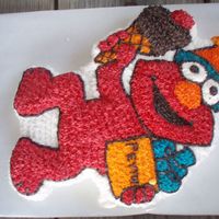 Elmo Cake I made this for my nieces first birthday. It was Strawberry cake with buttercream icing. She loved it!