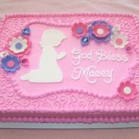 First Communion Cake First Communion cake for a little girl. Flowers and praying girl are cut from fondant, the rest is buttercream frosting.