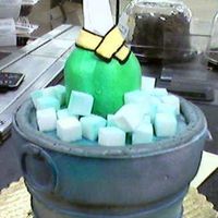 Champagne Bucket white cake bucket with cupcake bottle, iced in buttercream. the bottle neck is constructed with a straw stuck through the cupcake, and iced...