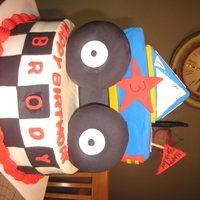 Monster Truck Buttercream with fondant. Everything is edible except the truck support and the roll bar