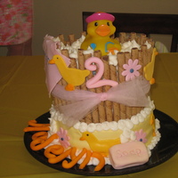 Rubber Ducky French vanilla cake covered in BC with fondant accents. Pirouettes were used around the top layer