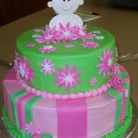 Daisy Shower Cake 12" strawberry cake with strawberry cream filling and 9" chocolate cake with cookies and cream filling. Both are BC with fondant...