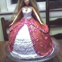 Barbie A last minute request from a friend. Yellow cake with buttercream icing. A few left-over gumpaste flowers from a previous cake were used on...