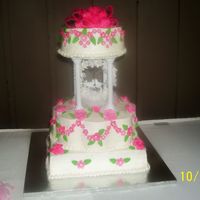Edmonds Wedding 12 ' petal stacked on 12" square tiered with 8" round. gumpast flowers and leaves with fondant bow. made my Granny Debbieand...