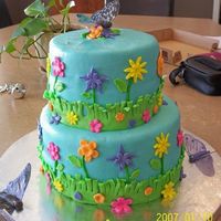 Flowers & Butterflies Stacked Chocolate w/chocolate pudding filling. MMF, First time making waferpaper butterflies. Had bulges initially but it got better as I...