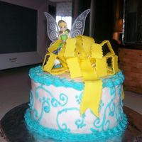 Tinkerbell Cake This is my sister's birthday cake. It is Swedish butter cake with strawberry filling, bc frosting and a fondant bow. I ended up buying...
