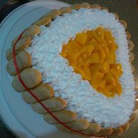 Carlota De Mango ESTA ELABORADO CON GALLETA Y UNA MEZCLA DE MERENGUE CON QUESO Y CAPAS DE GALLETA EN LA PARTE ALTA TIENE MANGO CON CREMA BATIDA