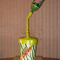 Pouring Mtn Dew This was a fun cake to create. There are 6 - 8" layers of Chocolate cake with Chocolate filling. Covered in Vanilla Buttercream, then...