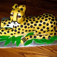 Cheetah Cake This is a cake I made for a girl;s birthday. Chocolate cake and chocolate filling. Wrapped in MMF. Way too many spots!
